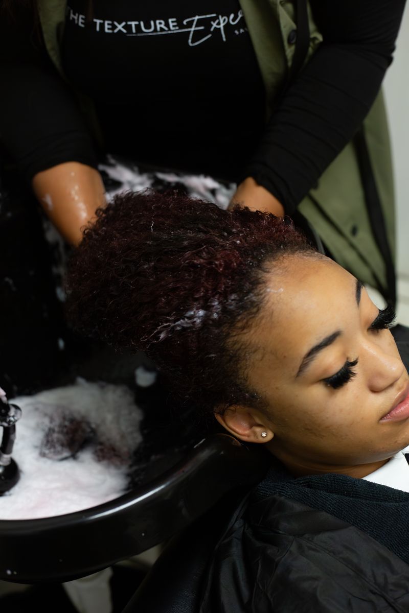 Student working on a client at ALA Beauty Academy