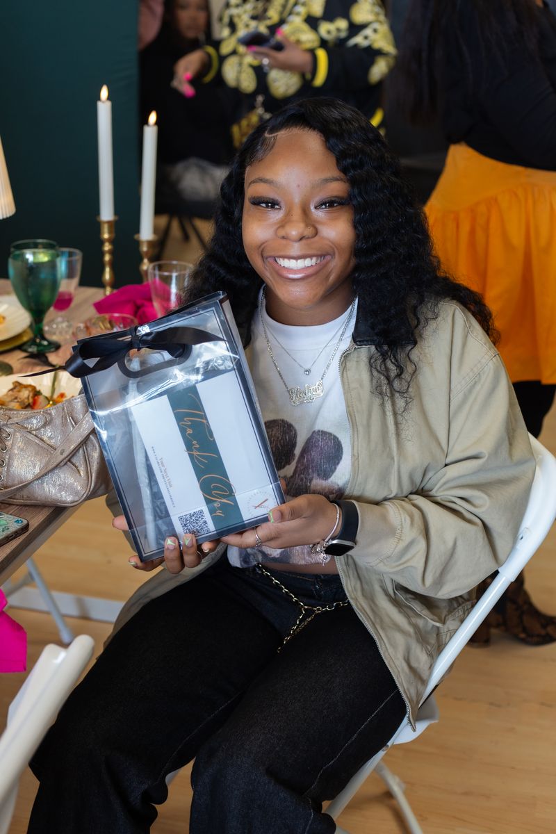 Student celebrating with a thank-you gift